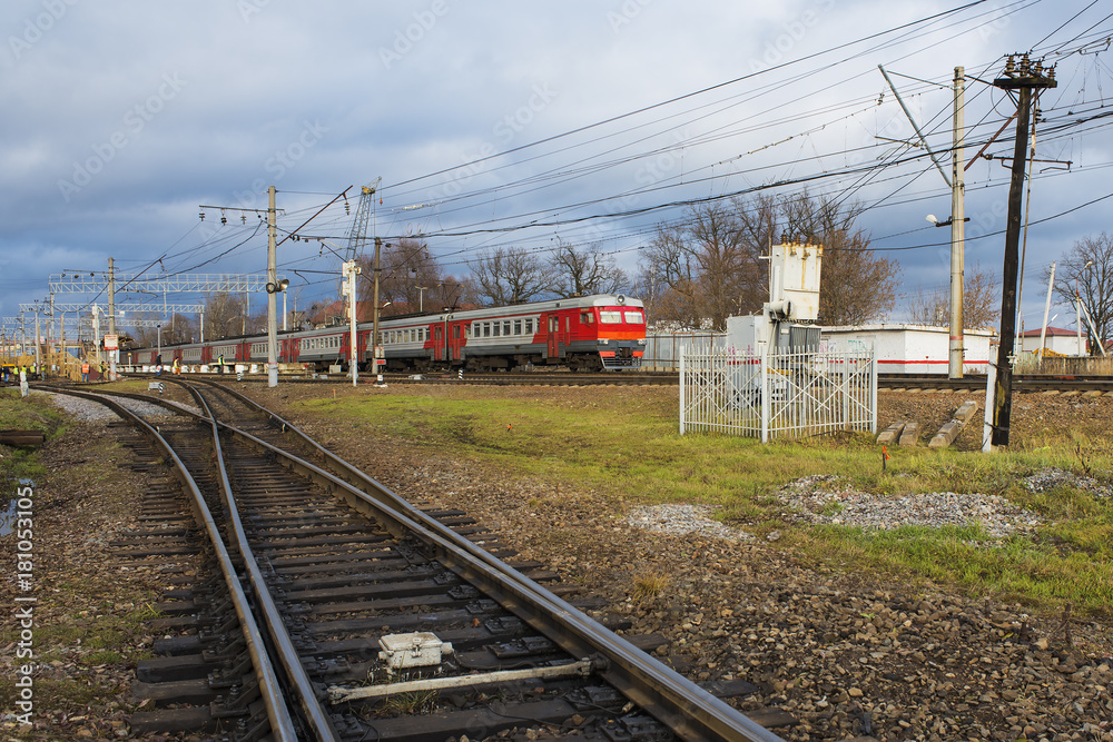 A commuter train arrives at the station. A commuter train arrives at the station.