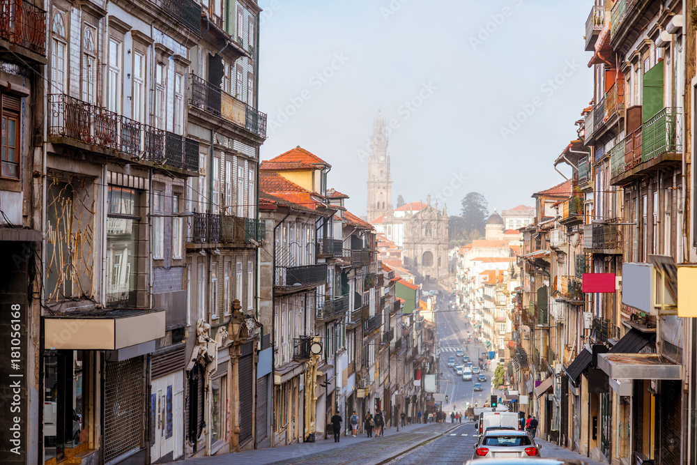 Street view with Clerics church during the foggy morning in Porto city, Portugal