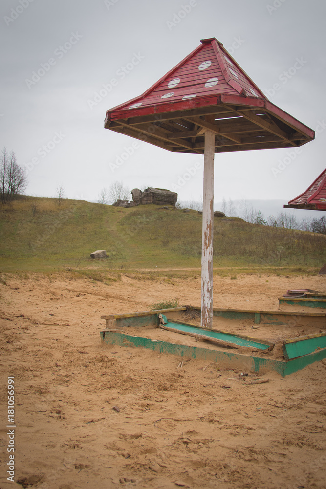 Fototapeta premium Beach wooden umbrellas on the beach with a red roof.