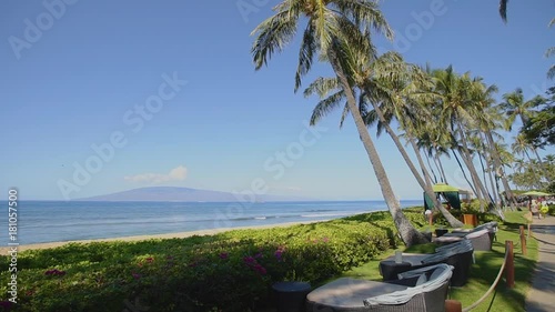 relax zone on the ocean beach among tropical nature on resort hyatt on the background of mauntains mauna loa with active volcano ,island maui,hawaii