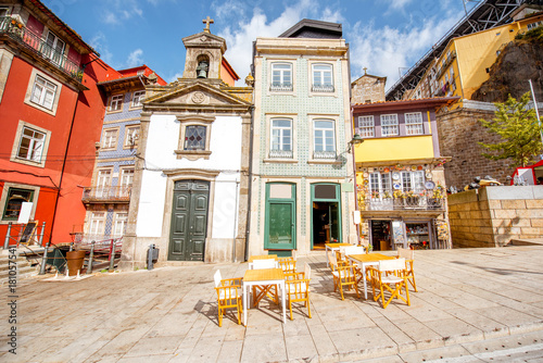 Fototapeta Naklejka Na Ścianę i Meble -  View on the Ribeira promenade with beautiful buildings and Lada chappel in Porto city, Portugal