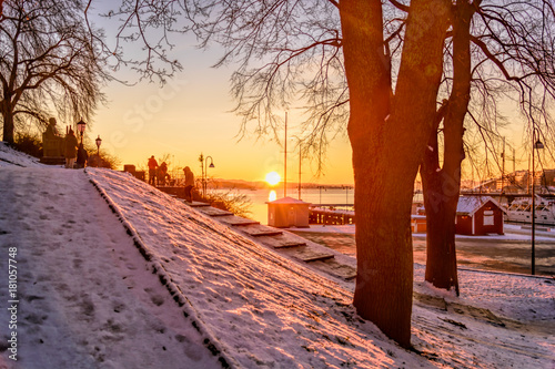 Beautiful sunset over snow covered city of oslo Norway photo