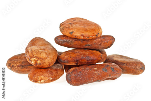 Heap of raw cocoa beans isolated on a white background
