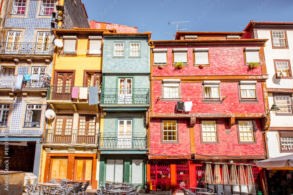 Street view on the beautiful old buildings with portuguese tiles on the facades in Porto city, Portugal Street view on the beautiful old buildings with portuguese tiles on the facades in Porto city, Portugal