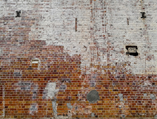 Damaged torn brick wall background