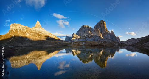 Mountain Lake Lago dei Piani at sunny morning, Tre Cime, Italian Dolomites, South Tirol. Reflection of mountains in water.