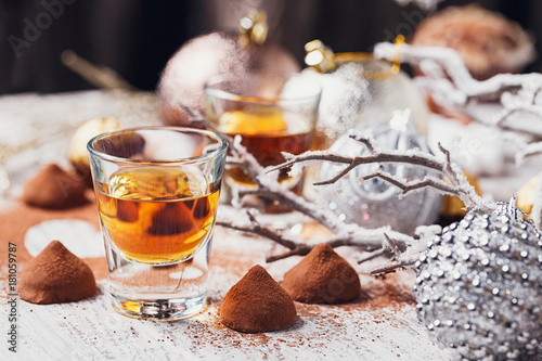 Whiskey or liqueur, truffle chocolate candies in cocoa powder an