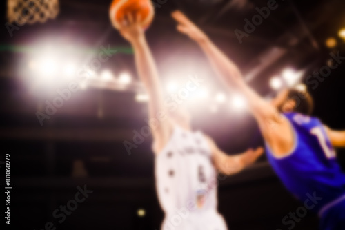 scoring during a basketball game - ball in hoop - blurred image
