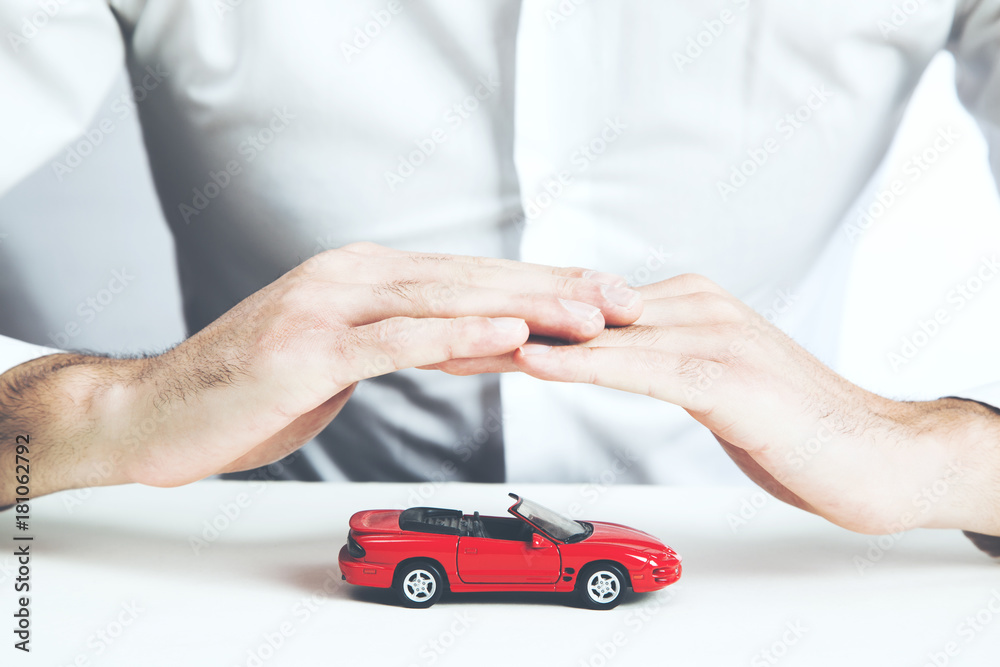 Man and model of car