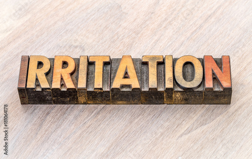 irritation word abstract in wood type