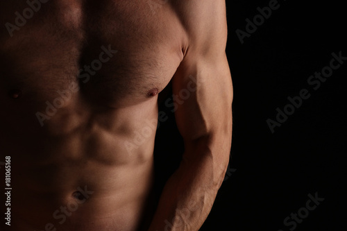 Strong Athletic Man muscular body  perfect male abdominal muscles close up.