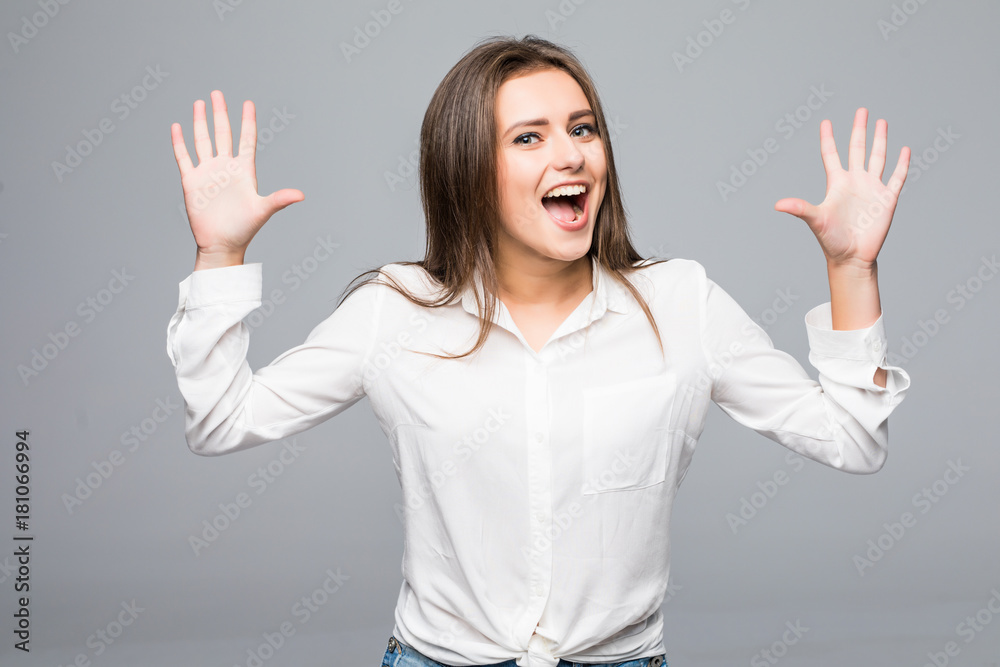 Surprised young woman in glasses over gray background Surprised young woman in glasses over gray background