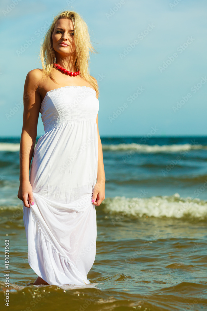 Young woman chilling out on the beach. Young woman chilling out on the beach.