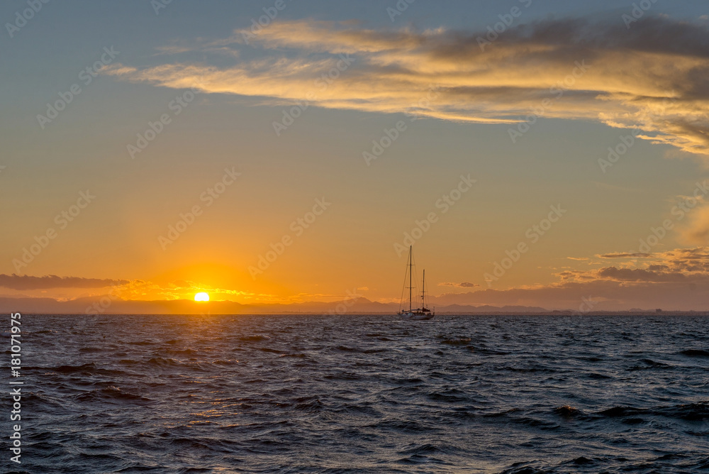 Sailing yacht and sunset in the sea. La Manga. Spain.

