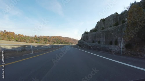 Branson MO,USA - November 10, 2017. POV. point view of autumn colors on a Branson road. Driving. Scenic view from car. photo