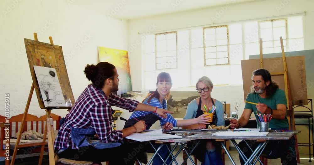 Group of artist practicing drawing at table Group of artist practicing drawing at table