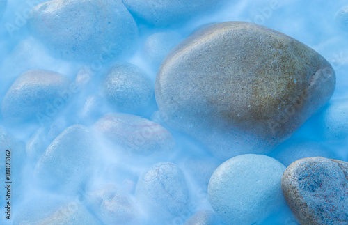 Group of stones eroded by the sea on the beach