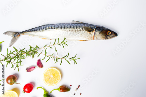 Raw mackerel fish with spices isolated on white