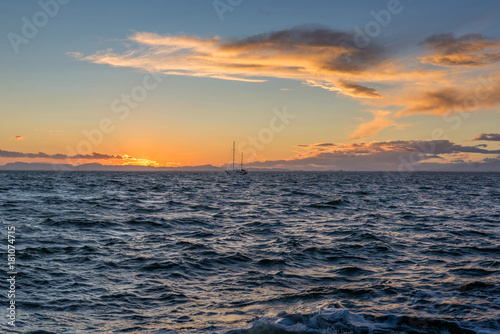 Sailing yacht and sunset in the sea. La Manga. Spain.    