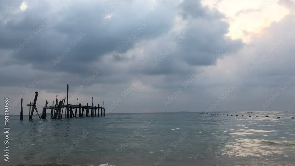 Time lapse movement sea and sky with Old wooden bridge on a beautiful morning time , landscape . Time lapse movement sea and sky with Old wooden bridge on a beautiful morning time , landscape .