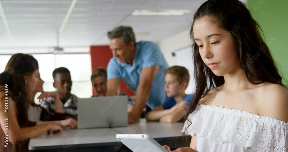 Happy schoolgirl using digital tablet Happy schoolgirl using digital tablet