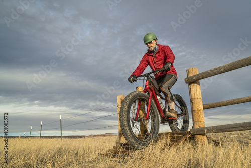 riding a mountain fat bike over cattle guard