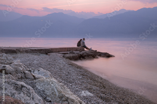 A romantic sunset over Garda lake at Malcesine, Verona, Veneto, Italy