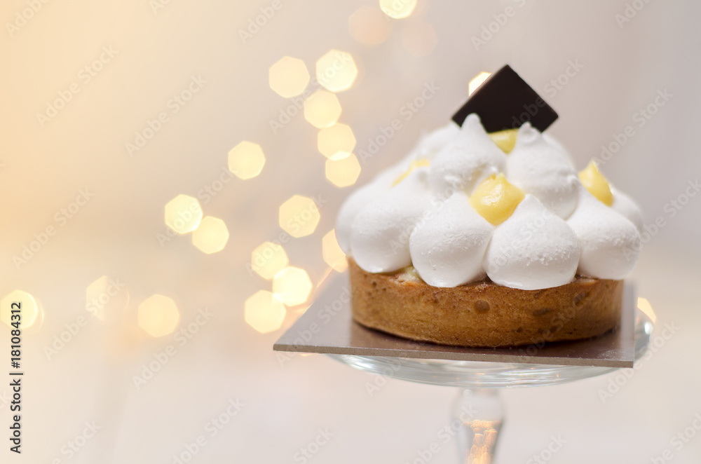 Gorgeous lemon meringue tart and bokeh background Gorgeous lemon meringue tart and bokeh background