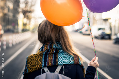 woman with colorful balloons