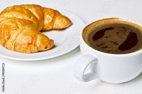 Coffee cup and croissant breakfast in the morning 