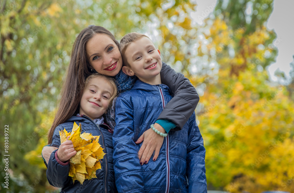 mother and two children among autumn mother and two children among autumn