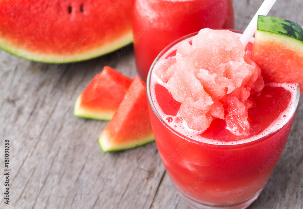 Closeup fresh watermelon smoothie in glass on wood table, Fruit drink for healthy concept Closeup fresh watermelon smoothie in glass on wood table, Fruit drink for healthy concept