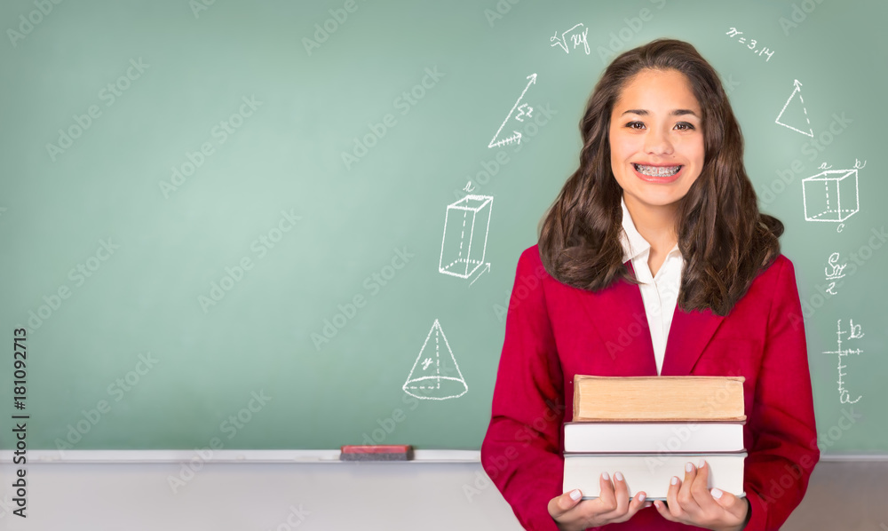 College Bound. Pretty ethnic or Hispanic teen in Front of Chalkboard with Copy Space College Bound. Pretty ethnic or Hispanic teen in Front of Chalkboard with Copy Space