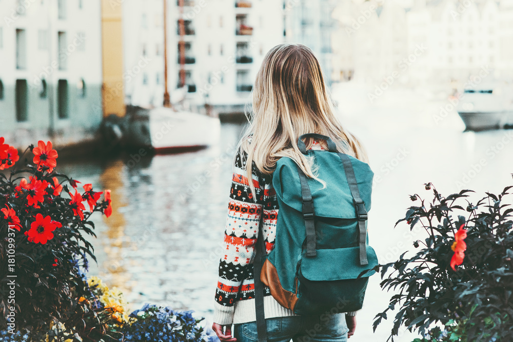 Tourist woman with backpack sightseeing walk in Alesund city Norway vacations weekend Travel Lifestyle fashion outdoor - obrazy, fototapety, plakaty 