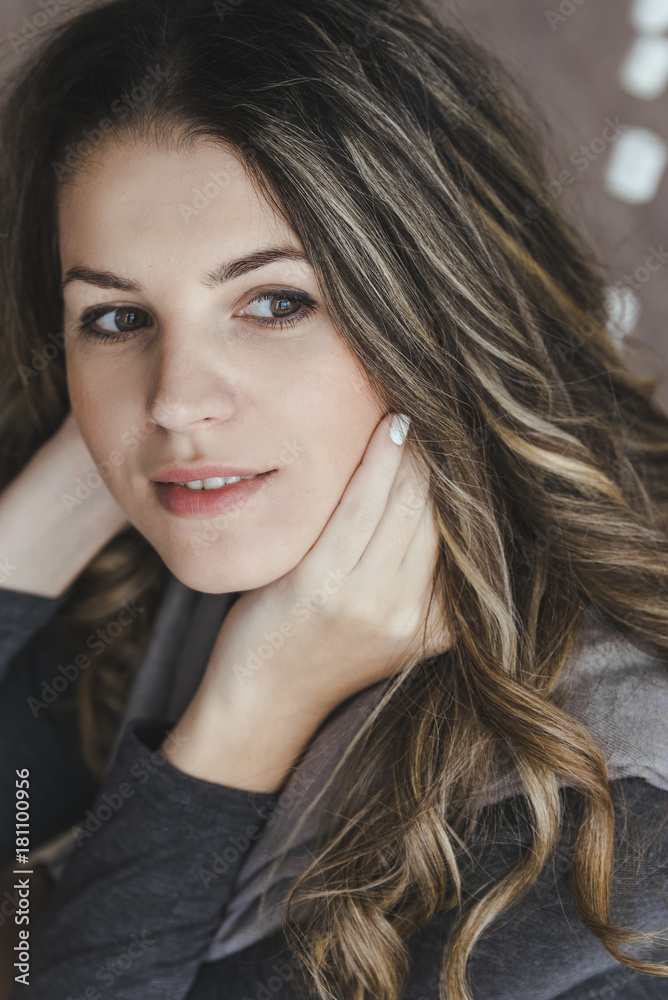 Pretty young woman portrait in white room decorated marshmellow garlands as winter scandinavian style Pretty young woman portrait in white room decorated marshmellow garlands as winter scandinavian style
