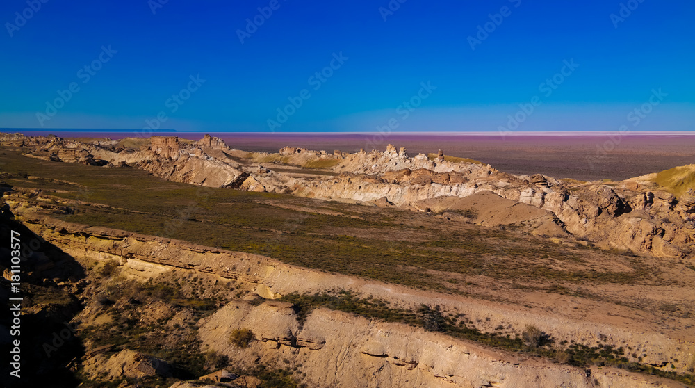 Panorama view to Aral sea from the rim of Plateau Ustyurt at sunset , Karakalpakstan, Uzbekistan