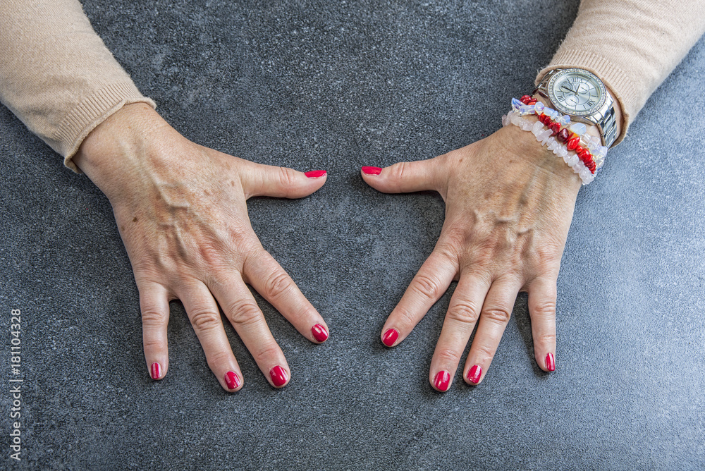 Manicure. Old Woman Hands Polishing Nails With Red Nail Polish In Beauty Salon. Stock Photo | Adobe Stock Manicure. Old Woman Hands Polishing Nails With Red Nail Polish In Beauty Salon. Stock Photo | Adobe Stock