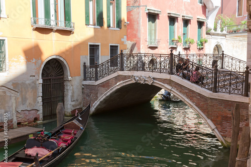  walk through the charming, narrow streets of Venice, typical but magical view - canals, bridges and old tenements with green shutters