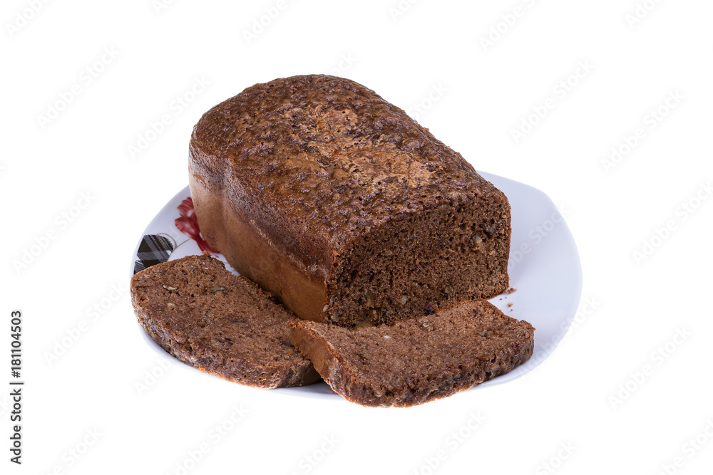 Homemade cocoa cake with walnuts and raisins baked in bread maker isolated on white background. Homemade cocoa cake with walnuts and raisins baked in bread maker isolated on white background.