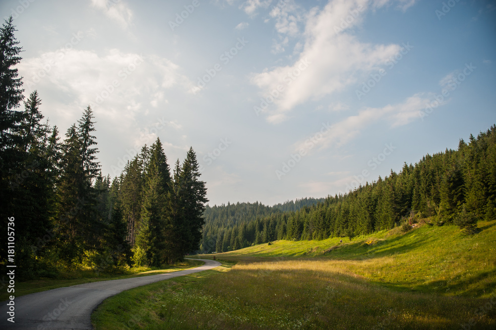 Mountain scenery with tiny curvy asfalt road Mountain scenery with tiny curvy asfalt road