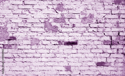 Old weathered brick wall pattern in violet tone