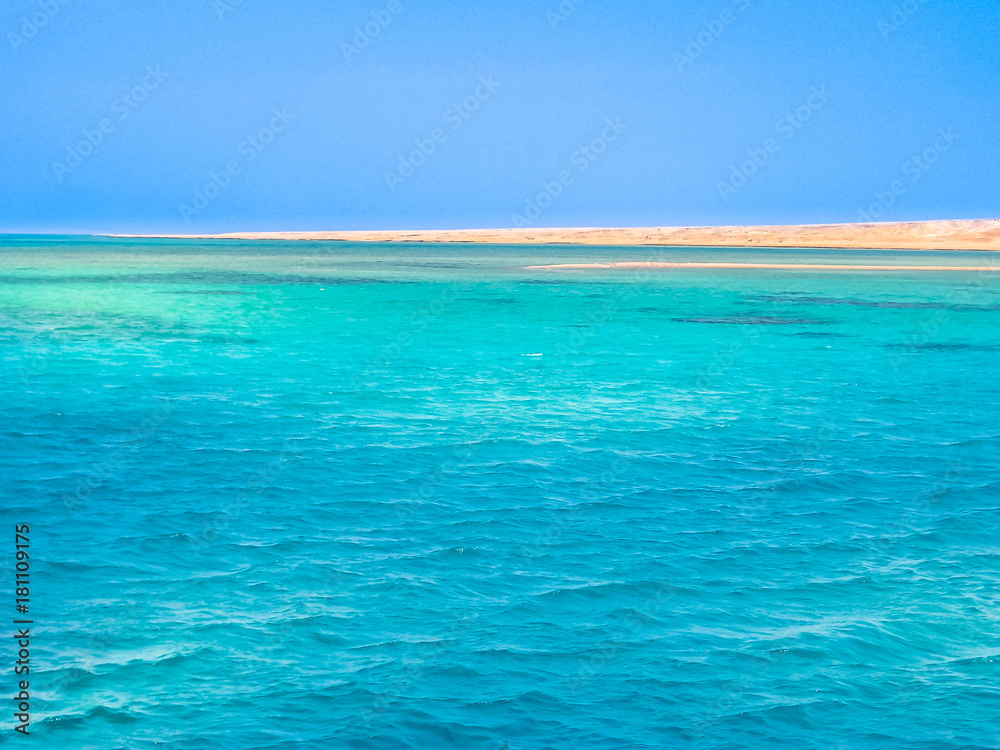 Background of blue sea of Ras Mohammed National Park with its clear and transparent waters and its famous reef in Sharm el Sheik, Sinai Peninsula, Egypt. Copy space. Background of blue sea of Ras Mohammed National Park with its clear and transparent waters and its famous reef in Sharm el Sheik, Sinai Peninsula, Egypt. Copy space.