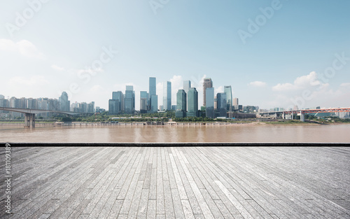 empty brick floor with modern cityscape