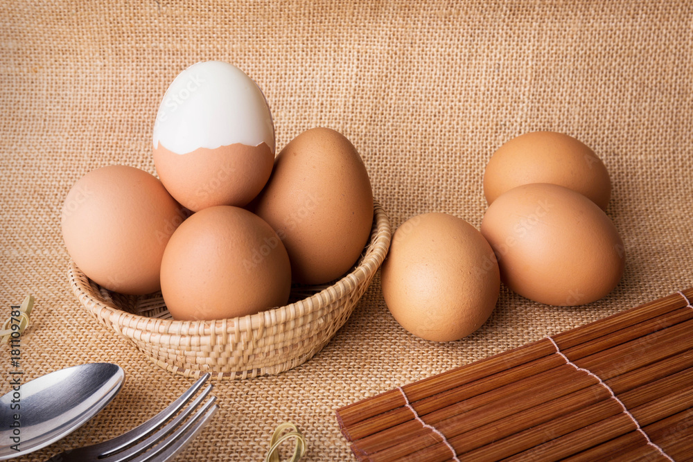 Set Eggs in a basket on gunny (sackcloth) background Set Eggs in a basket on gunny (sackcloth) background