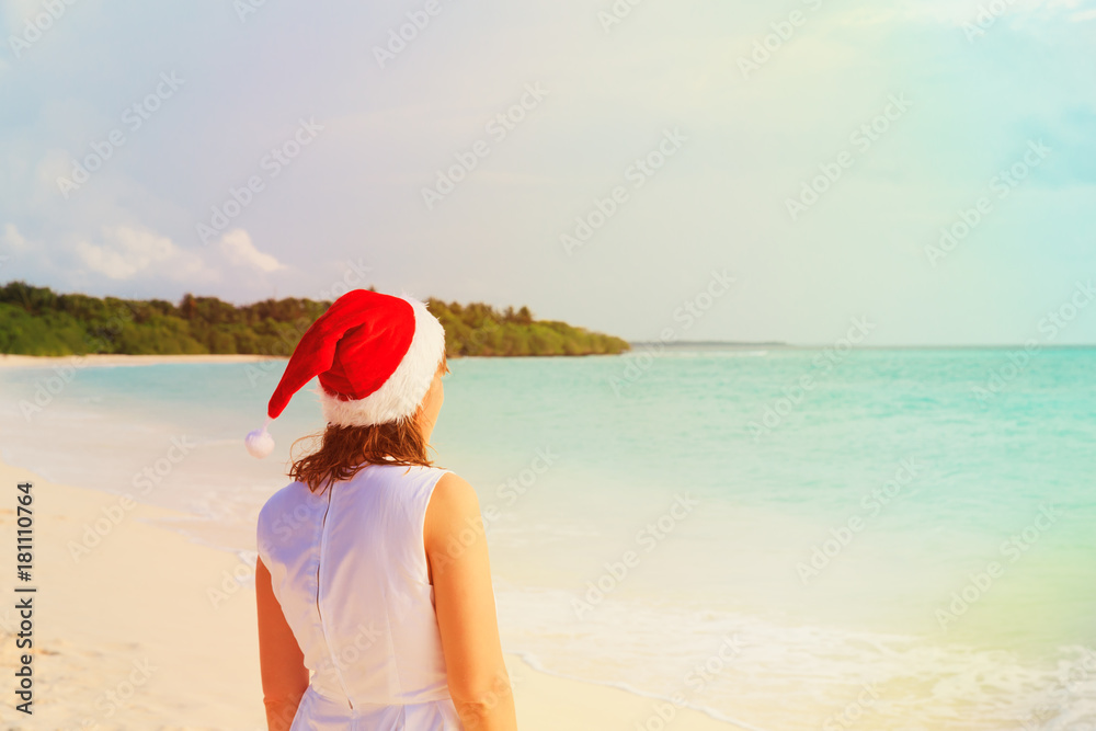 young woman looking at beach on Christmas vacation young woman looking at beach on Christmas vacation