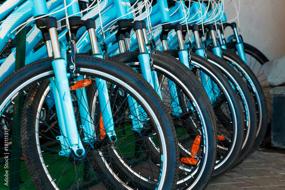 Many identical bicycles in a row