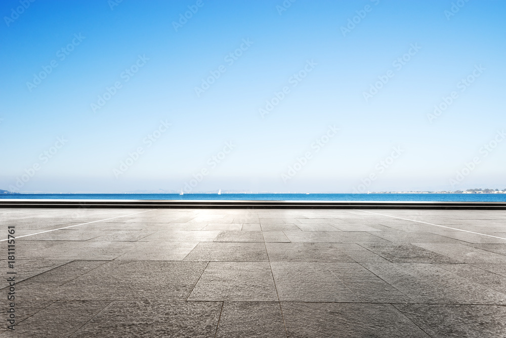 empty marble floor with blue sea in blue sky