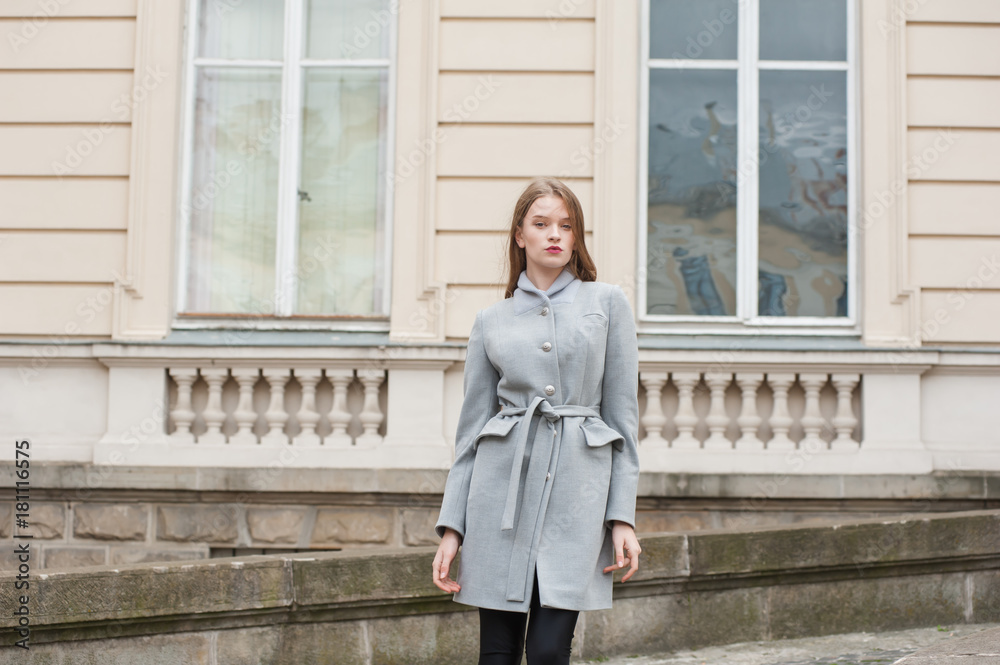 Beautiful young woman walking through the streets of Paris