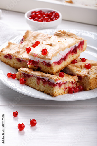 Red currant fruit pie bars with meringue on top.