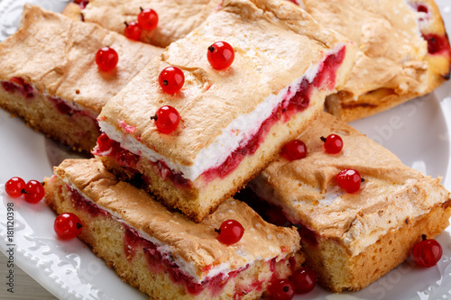 Red currant fruit pie bars with meringue on top.